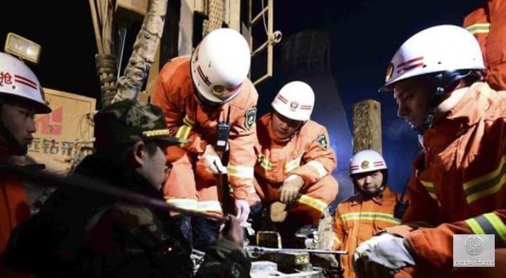 Emergency responders search for survivors amid hazardous conditions near the mine entrance.